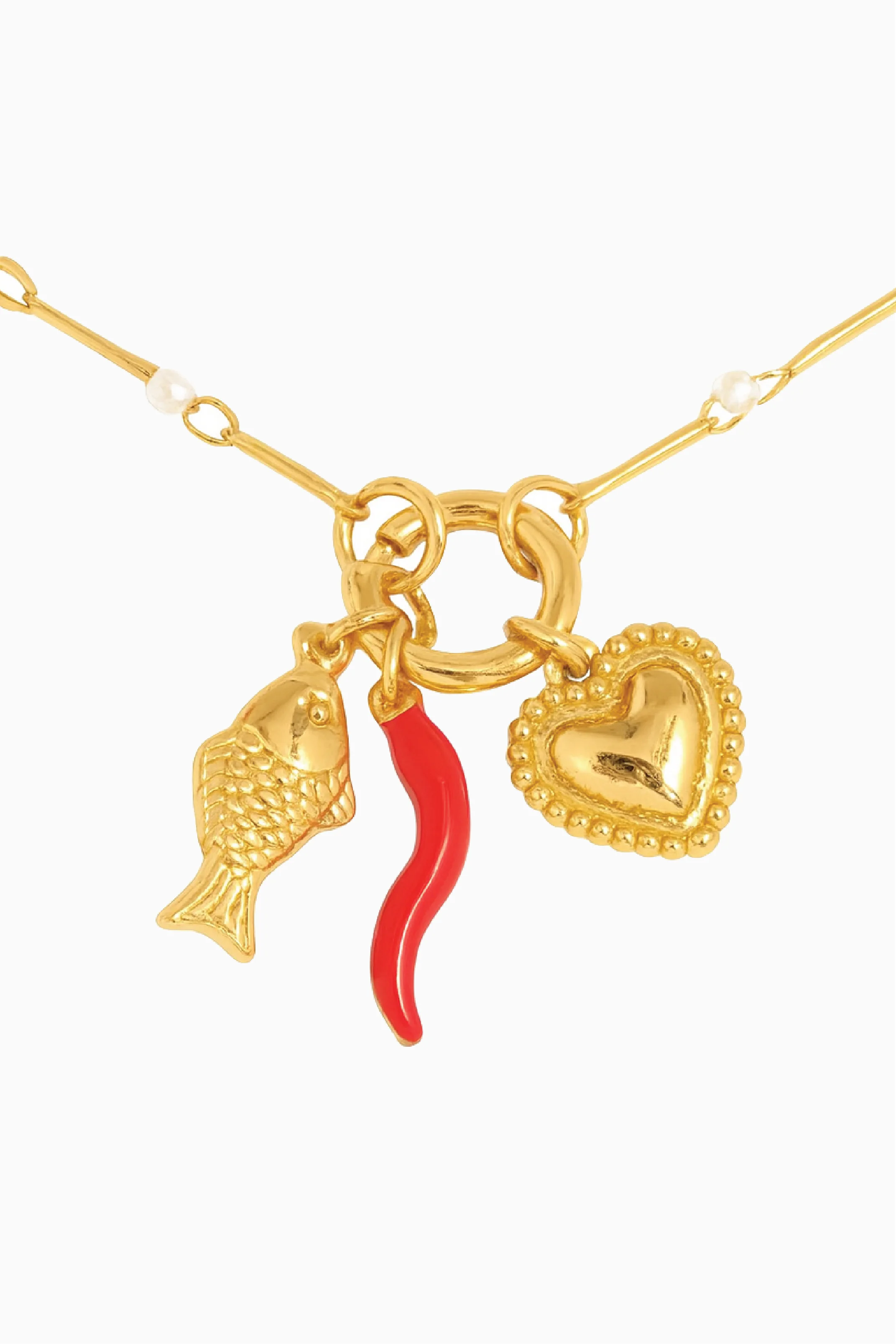 Gold necklace with fish, red chili pepper, and heart charms on a white background