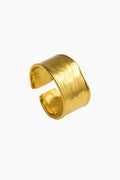 Gold open cuff bracelet on a white background