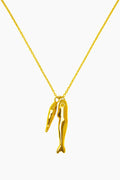 Gold necklace with a unique pendant on a white background